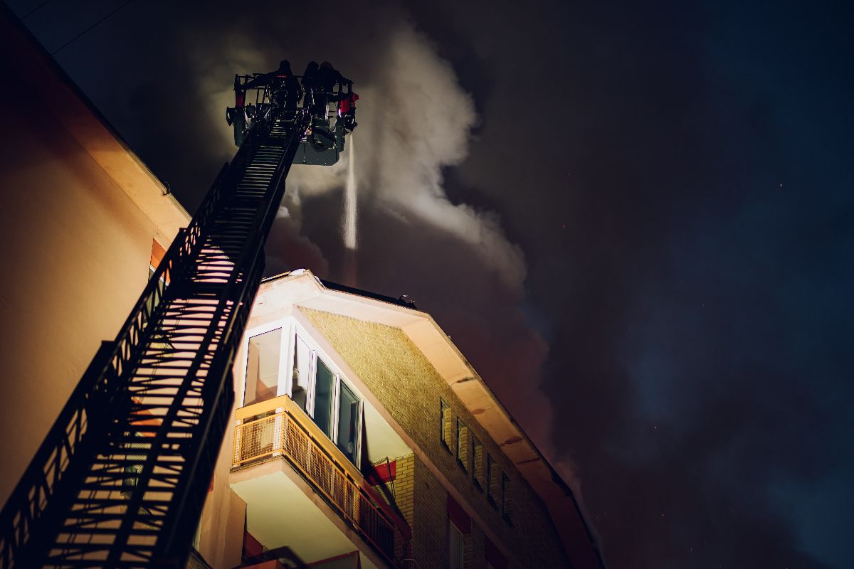 Firefighters putting out a fire in a residential building