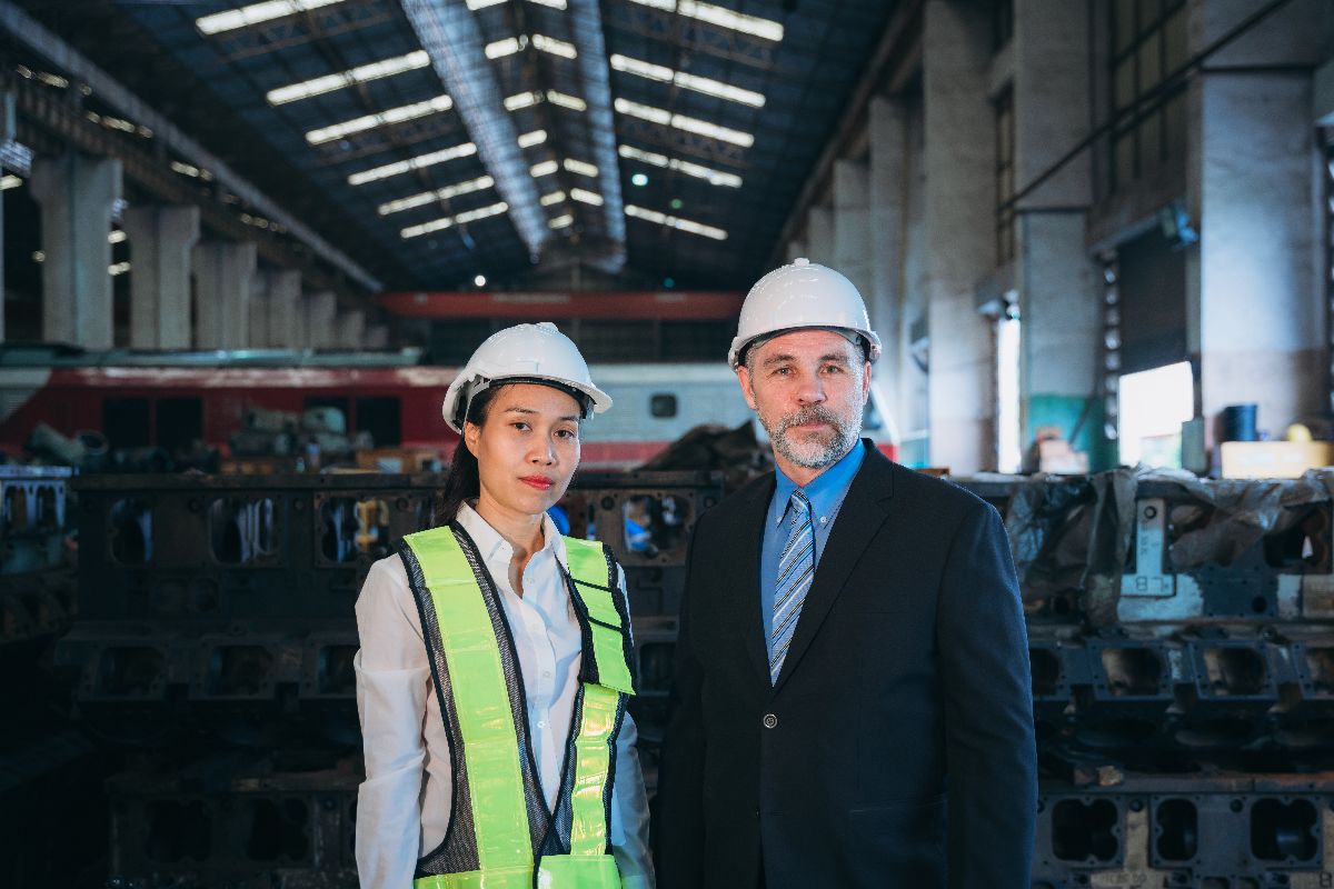 Managers in a facility checking for compliance requirements